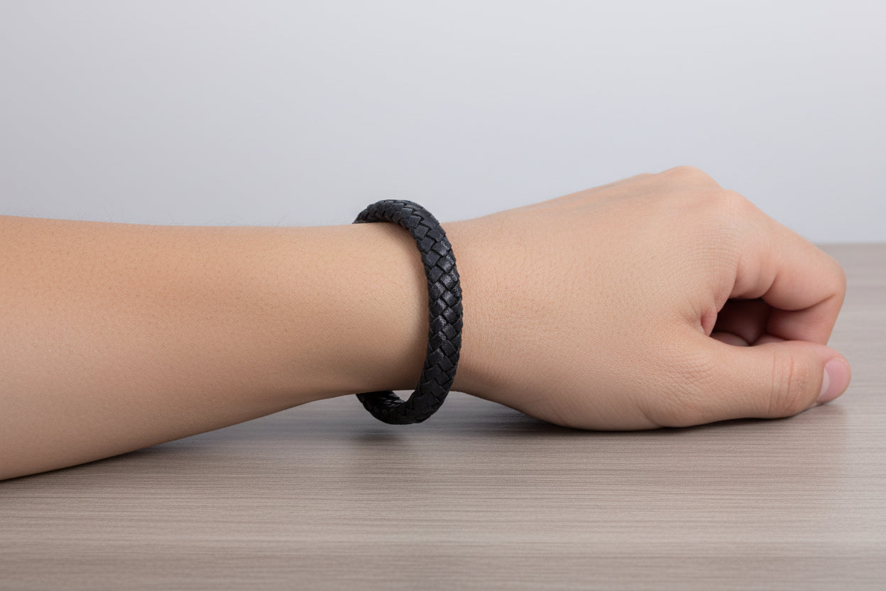 Black braided leather bracelet on wrist