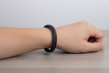 Black braided leather bracelet on wrist