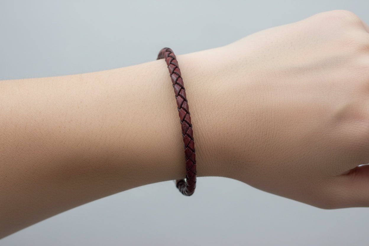 Dark red bracelet on wrist