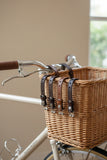 Three leather straps in dark brown, medium brown, and black, each with silver-toned metal buckles, 