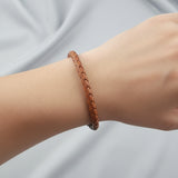 light brown bracelet on wrist