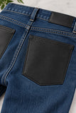  Black leather pockets on a pair of jeans