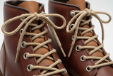 Shoe & Boot Laces Cream and Brown Stripe round in a pair of boots